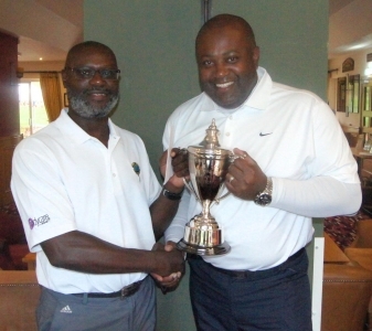 Winner - Emrys Karemo (left) receiving the TNCM trophy from Owen Mendez