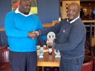 Winner Dean Leith (left) receiving his award from CGS vice-captain Lloyd Thomas