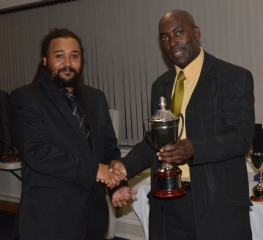 2012 Order of Merit Winner Frank McCook (left) receiving his award from Ronald Ross